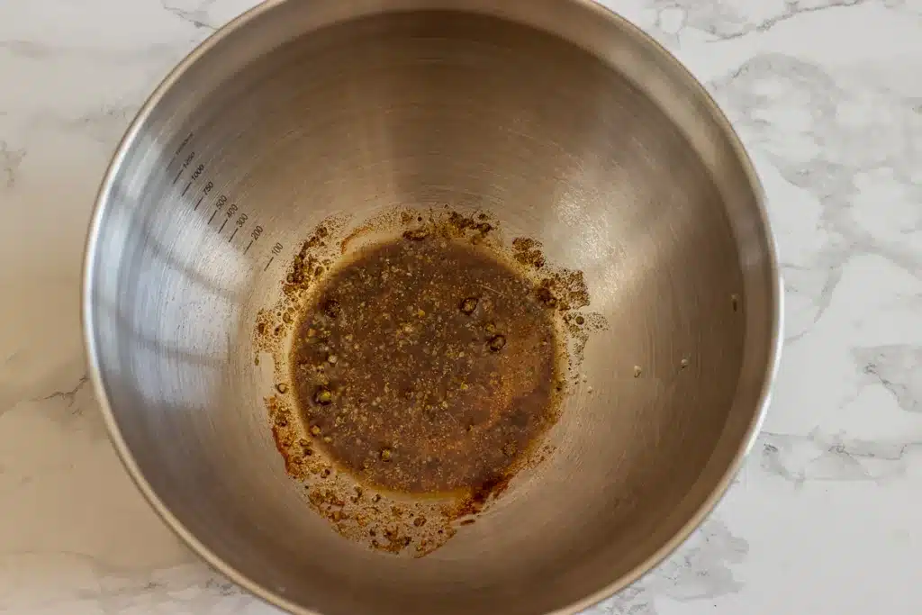 olive oil and seasoning are placed in a large bowl