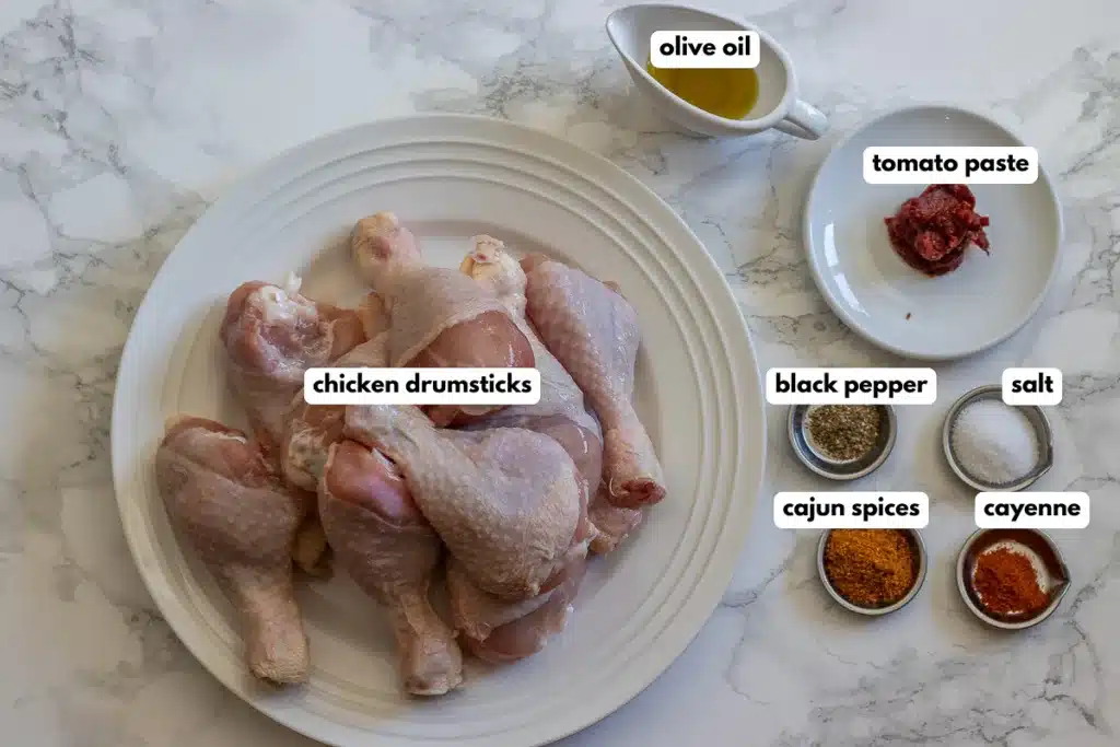 labelled picture of ingredients for crispy air fryer chicken drumsticks