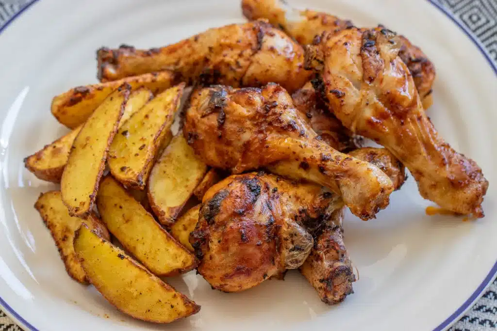air fried chicken drumsticks served with potato wedges